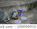 A bottle of cup sake placed on the stone steps in the city 100099910