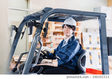 Male worker driving a forklift on site Male worker driving a forklift on site 100101511