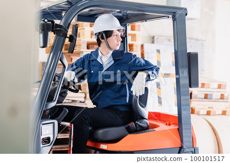 Male worker driving a forklift on site 100101517