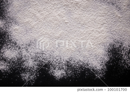 White scattered flour on a black background. Flour texture. 100101700