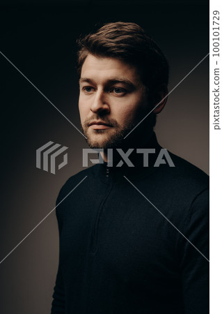 The young guy thought. Portrait on a dark background. The young guy thought. Portrait on a dark background. 100101729