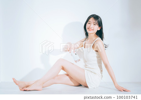 A woman using a home epilator A woman using a home epilator 100103741