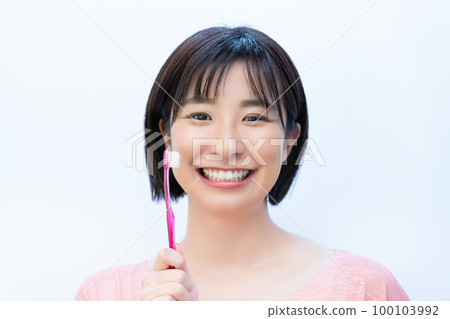 woman brushing teeth woman brushing teeth 100103992