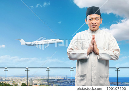 Asian Muslim man with greeting gesture 100107300