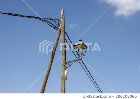 Old style lantern on a wooden pole, Spain 100108060