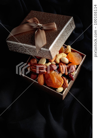 Dried fruits and nuts in a gift box. 100108114