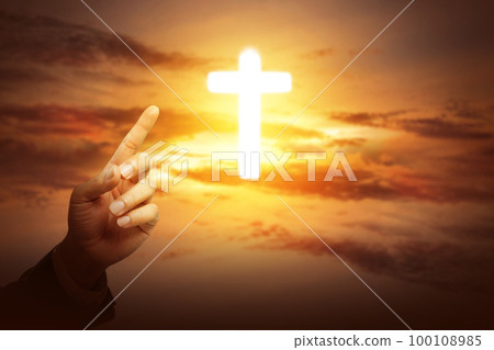 Human hand showing Christian cross 100108985