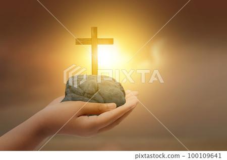 Human hand showing Christian cross 100109641