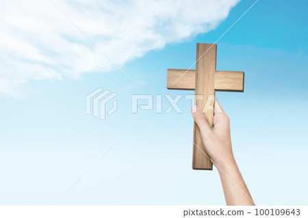 Human hand holding Christian cross Human hand holding Christian cross 100109643
