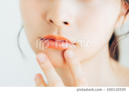 Young lady's lips 100110595