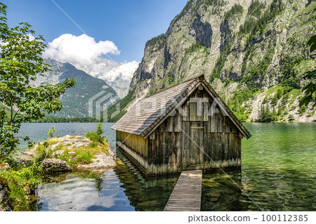 Boathouse at Obersee Lake behind the Watzmann massif, Salet at Koenigssee, Berchtesgaden National Park, Germany Boathouse at Obersee Lake behind the Watzmann massif, Salet at Koenigssee, Berchtesgaden National Park, Germany 100112385