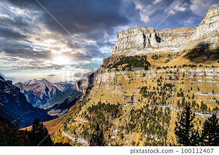 Autumn view of beautiful nature in Ordesa and Monte Perdido NP, Pyrenees, Aragon in Spain. Autumn view of beautiful nature in Ordesa and Monte Perdido NP, Pyrenees, Aragon in Spain. 100112407