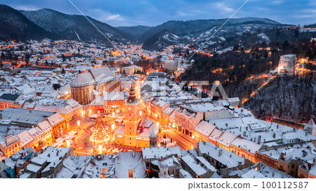 Brasov, Romania - Winter scenic landscape with Christmas Market and Carpathian Mountains Brasov, Romania - Winter scenic landscape with Christmas Market and Carpathian Mountains 100112587