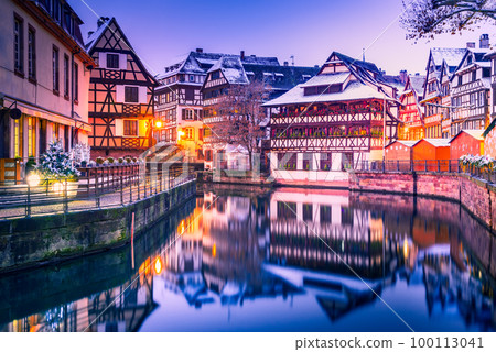 Strasbourg, Alsace, France - Petit France twilight water reflection. Strasbourg, Alsace, France - Petit France twilight water reflection. 100113041
