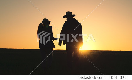 Agriculture. group people work sunset wheat field. teamwork silhouette. farming concept. farmer works tablet with business partner field. team people meeting. agriculture concept. smart farm wheat Agriculture. group people work sunset wheat field. teamwork silhouette. farming concept. farmer works tablet with business partner field. team people meeting. agriculture concept. smart farm wheat 100113221