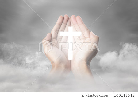 A human hand showing a Christian cross A human hand showing a Christian cross 100115512