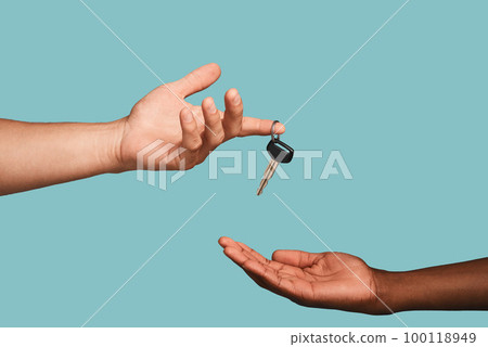 Hands, key or car dealership with a salesman and customer in studio on a blue background for purchase. Transport, vehicle and deal with an automobile dealer handing keys to a consumer after a sale Hands, key or car dealership with a salesman and customer in studio on a blue background for purchase. Transport, vehicle and deal with an automobile dealer handing keys to a consumer after a sale 100118949