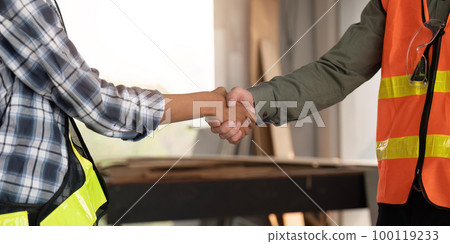Shot of engineer builders shaking hands at a construction site to agree to work together Shot of engineer builders shaking hands at a construction site to agree to work together 100119233