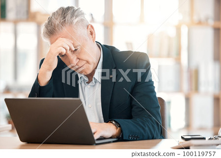 Stress, laptop and management with a senior man in business feeling anxiety or the pressure of a deadline. Computer, glitch and corporate with a mature male manager working on a review in his office 100119757