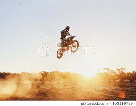 Hes flying through the air. A shot of a motocross rider in midair during a race. 100119759