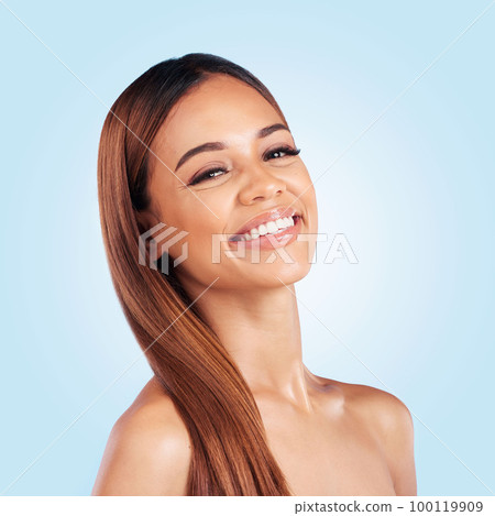 Portrait, hair and keratin with a model black woman in studio on a blue background for natural haircare. Face, skincare and beauty with an attractive young female feeling proud of her hairstyle 100119909