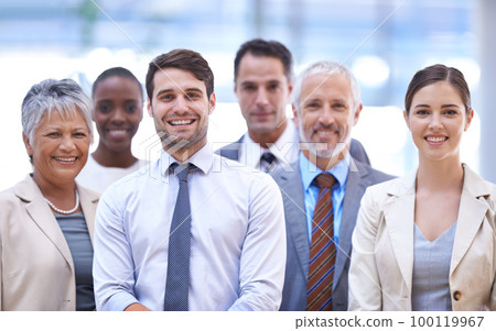 This team is all smiles. Cropped shot of a group of office coworkers. 100119967