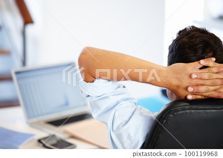 Note to self Relax. Rear view of a businessman taking a break from his work assignments. 100119968