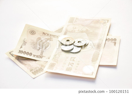 Japanese yen banknote and coin on white background Japanese yen banknote and coin on white background 100120151