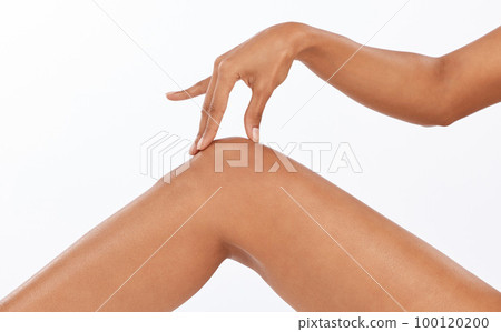 Beauty, epilation and closeup of legs in studio with shaving, hair removal or depilation treatment. Body care, wellness and woman model with moisturizing, skin and health routine by white background. 100120200