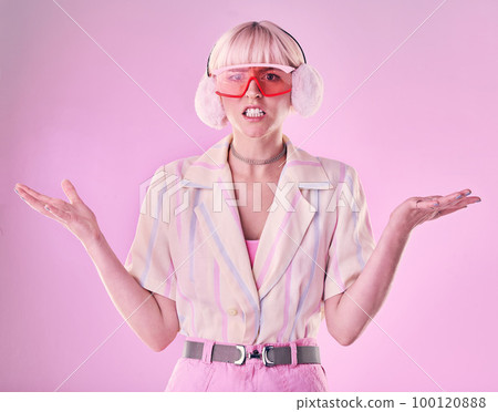 Confused, angry and portrait of a woman with fashion isolated on a pink background in a studio. Anxiety, sad and stylish girl model wearing ear muffs while frustrated with anger and a problem Confused, angry and portrait of a woman with fashion isolated on a pink background in a studio. Anxiety, sad and stylish girl model wearing ear muffs while frustrated with anger and a problem 100120888