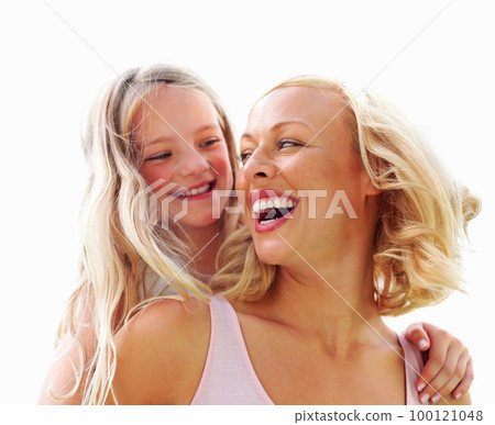 Mother and daughter enjoying piggyback ride. Mother and daughter enjoying piggyback ride and looking at each other. Mother and daughter enjoying piggyback ride. Mother and daughter enjoying piggyback ride and looking at each other. 100121048