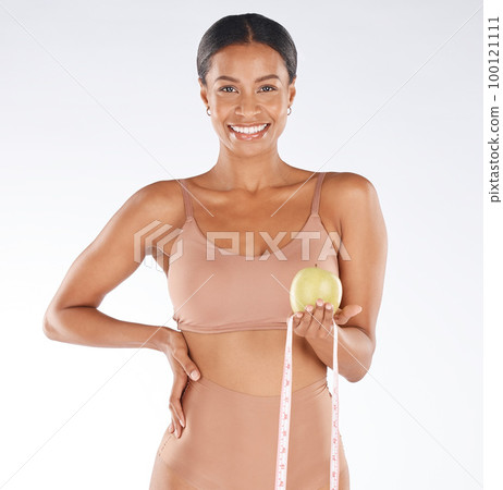 Health diet, apple and happy woman with tape measure to track weight loss transformation, fitness model or body goals. Fruit detox, vegan healthcare food and portrait girl with nutritionist lifestyle Health diet, apple and happy woman with tape measure to track weight loss transformation, fitness model or body goals. Fruit detox, vegan healthcare food and portrait girl with nutritionist lifestyle 100121111
