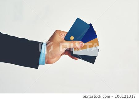 Youll never have to carry cash again. Studio shot of an unidentifiable businessman holding a selection of credit cards against a white background. Youll never have to carry cash again. Studio shot of an unidentifiable businessman holding a selection of credit cards against a white background. 100121312