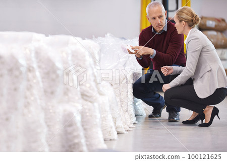 Inspecting the raw materials. Shot of two factory managers doing an inspection of raw materials. Inspecting the raw materials. Shot of two factory managers doing an inspection of raw materials. 100121625