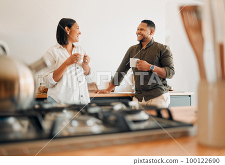 Loving couple drinking coffee and talking, bonding and having fun while spending time together at home. Smiling, in love and carefree couple hugging and sharing a romantic moment enjoying the morning Loving couple drinking coffee and talking, bonding and having fun while spending time together at home. Smiling, in love and carefree couple hugging and sharing a romantic moment enjoying the morning 100122690