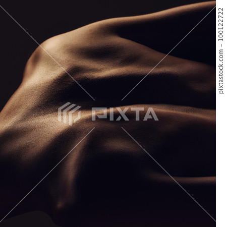 Body, muscle and back of man on black background for self care, exercise goal and bodybuilder training. Light aesthetic, fitness and silhouette shadow of male for strong spine, wellness and skin glow 100122722