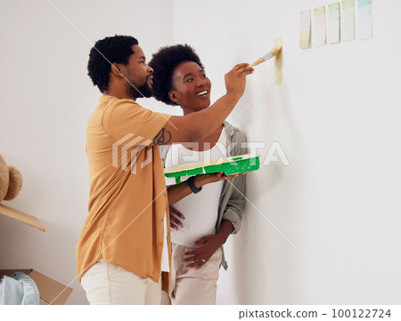 Painting, wall or home with a black couple in DIY, renovation or house remodel together with a paintbrush. Teamwork, partners or African man with happy pregnant woman excited about baby or new family Painting, wall or home with a black couple in DIY, renovation or house remodel together with a paintbrush. Teamwork, partners or African man with happy pregnant woman excited about baby or new family 100122724