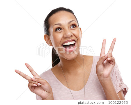 Peace sign, hands and face of woman on a white background for happy, relaxing and positive mindset. Beauty, emoji and carefree girl isolated in studio with hand gesture for calm, wellness and zen 100122953