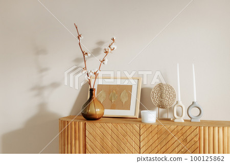 Wooden chest of drawers in a modern interior. Wooden chest of drawers in a modern interior. 100125862