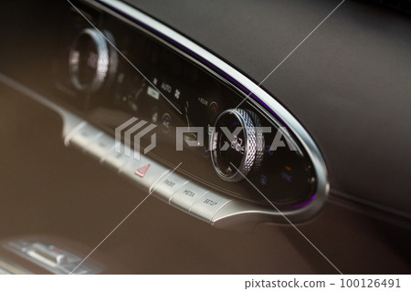 Digital control panel car air conditioner dashboard. Modern car interior conditioning buttons inside a car close up view. 100126491