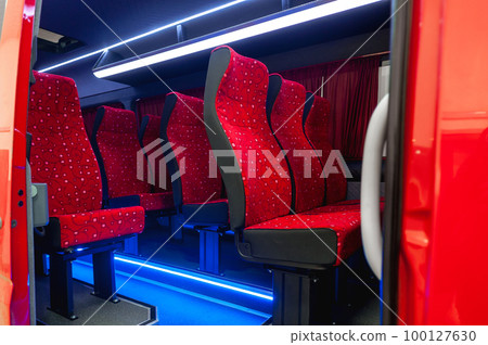 Comfortable interior of a passenger bus with soft seats Comfortable interior of a passenger bus with soft seats 100127630