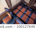 Comfortable interior of a passenger bus with soft seats 100127646