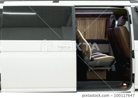 Comfortable interior of a passenger bus with soft seats 100127647