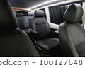Comfortable interior of a passenger bus with soft seats 100127648