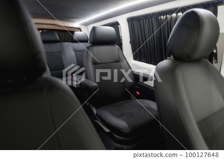 Comfortable interior of a passenger bus with soft seats Comfortable interior of a passenger bus with soft seats 100127648