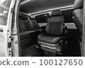 Comfortable interior of a passenger bus with soft seats 100127650