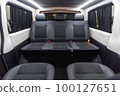 Comfortable interior of a passenger bus with soft seats 100127651