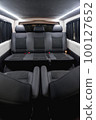 Comfortable interior of a passenger bus with soft seats 100127652