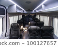 Comfortable interior of a passenger bus with soft seats 100127657
