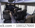 Comfortable interior of a passenger bus with soft seats 100127660